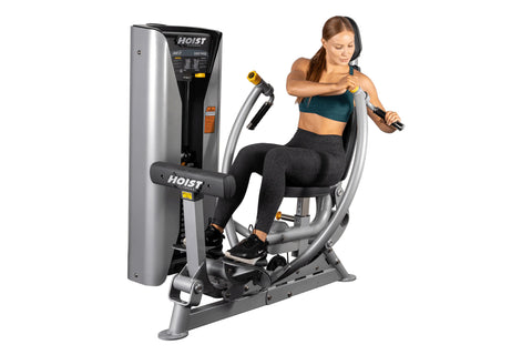 Hoist ROC-IT chest press machine with silver frame, gray padded seat and back, yellow hand grips, and control panel on white 