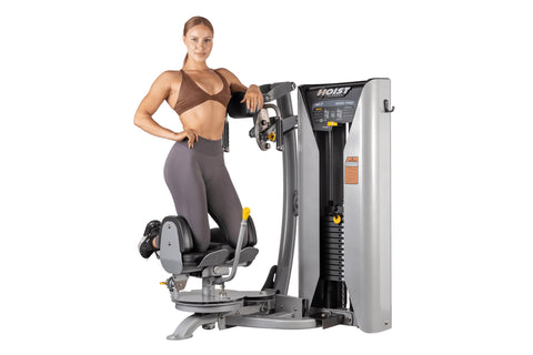 Hoist ROC-IT Rotary Torso Machine with silver and black frame, gray padded seat, dual handles, and control panel on white bac