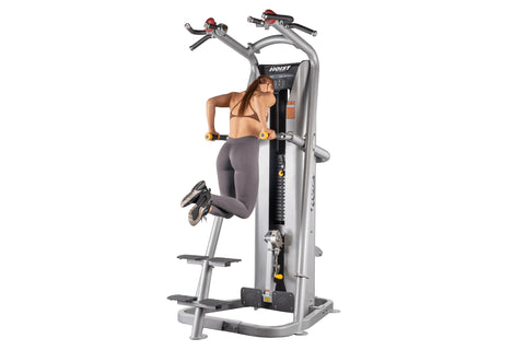 Hoist ROC-IT Chin/Dip Assist Machine with silver frame, black seat, red handles, and yellow grip accents on white background