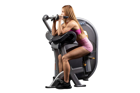 Gray and black Hoist Triceps Extension machine with padded seat, handlebar controls, and stabilizing base on white background
