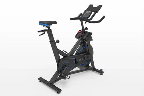 Horizon 7.0 IC black and blue indoor stationary bike with blue seat, digital display console, and dual handlebars on white ba