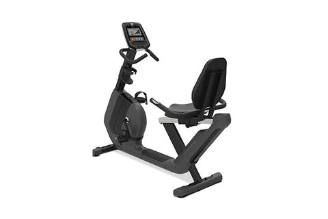 Black recumbent exercise bike with digital display console, padded seat, and sturdy frame base on white background
