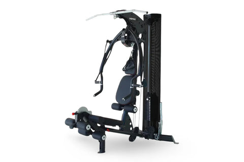 Black and navy Inspire Fitness M2 multi-gym system with cable machine, seat, and leg press attachment on white background