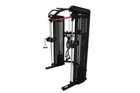 Black and silver functional trainer with dual cable towers, overhead bar, and suspended handles on white background