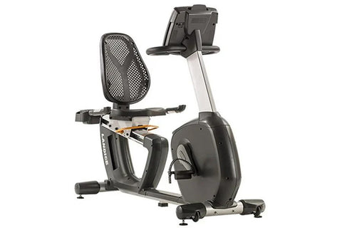 Landice R7 black recumbent exercise bike with digital display console, mesh back seat, and silver frame on white background