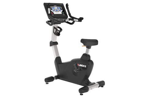 Landice U9 commercial upright exercise bike with black and silver frame, digital console display, and black padded seat on wh