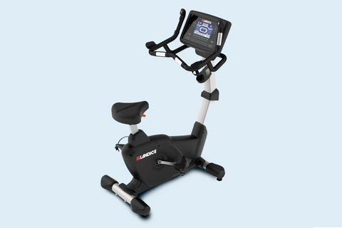 Landice U9 black upright exercise bike with digital display console and adjustable seat, on white background