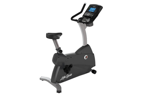 Life Fitness C3 upright stationary exercise bike with black seat, gray frame, digital console display, and hand grips on whit
