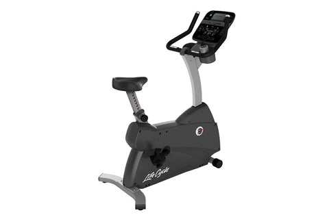 Life Fitness C3 upright stationary exercise bike with black seat, gray frame, digital console display, and hand grips on whit