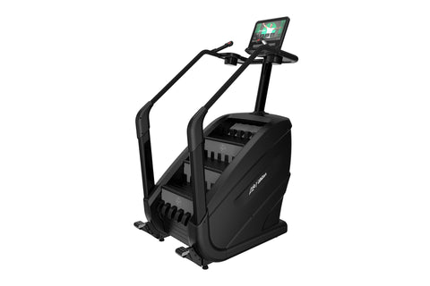 Black stair climbing machine with dual handles, control console, and digital display screen showing workout interface