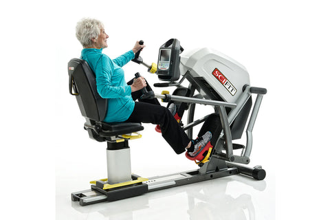 SCIFIT StepOne total body recumbent stepper with gray and red frame, black seat, red foot pedals, and digital display console