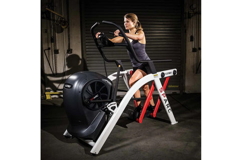 Black Life Fitness SPARC arc trainer elliptical with dual handles, foot pedals, and curved frame on white background