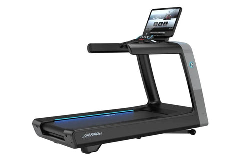 Black and gray Life Fitness treadmill with digital touchscreen display and blue accent lighting on running belt, viewed from 