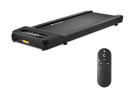 Black under-desk treadmill with textured running surface and control panel, shown with black remote control featuring start a