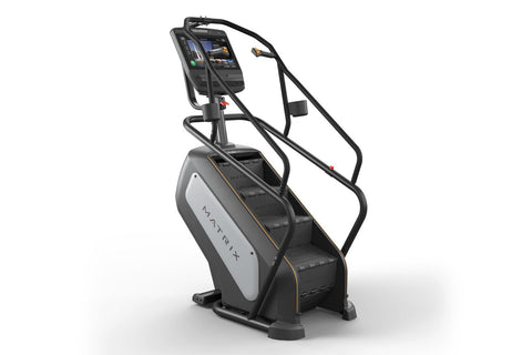 Matrix Endurance ClimbMill with black frame, gray and white base, digital display console, and dual black handrails on white 