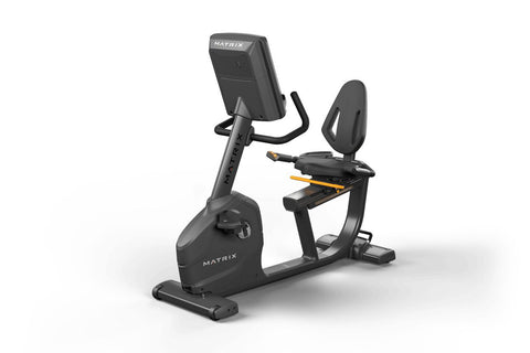 Matrix black recumbent exercise bike with digital touchscreen console displaying workout content, padded seat with backrest, 
