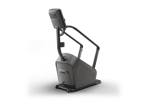 Black stair climbing exercise machine with digital display console showing calorie count and bronze accents on steps, on whit
