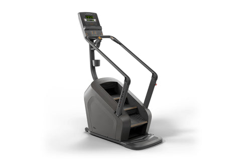 Black stair climbing exercise machine with digital display console showing calorie count and bronze accents on steps, on whit