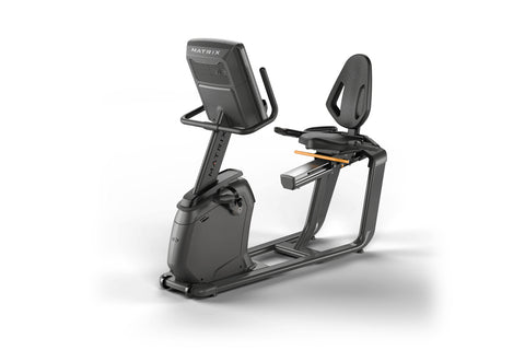 Black and gray Matrix recumbent exercise bike with digital display screen and padded seat, shown on white background