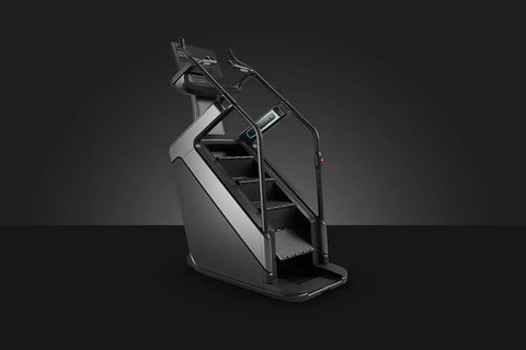 Matrix Onyx ClimbMill stair climbing machine with black frame, digital display console, and textured pedal platform on white 
