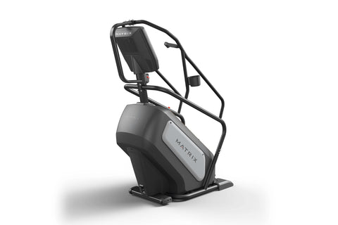 Matrix Performance ClimbMill with black frame, white side panel, digital touchscreen display, and dual handrails on white bac