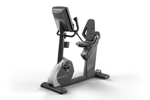 Matrix Performance Hybrid Cycle upright exercise bike with digital display screen and black padded seat on white background