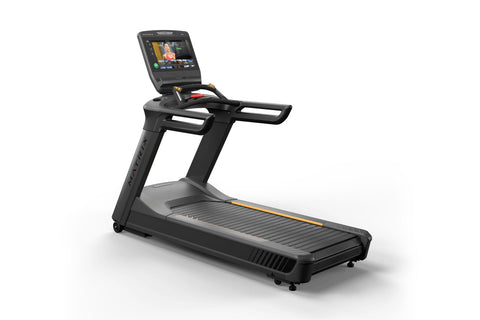 Black and gray motorized treadmill with touchscreen display console, black handles, and gold accents, on white background