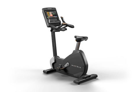 Matrix black upright exercise bike with digital touchscreen console, adjustable handlebars and seat, on white background