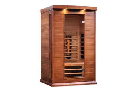 Red cedar two-person infrared sauna with glass front door, wooden benches, and overhead LED lighting on white background