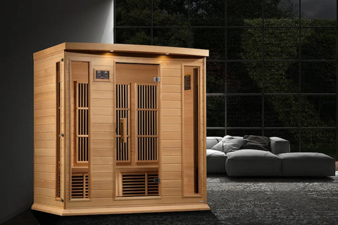 Cedar wood infrared sauna cabin with four seats, carbon heaters, glass doors, and overhead lighting on white background
