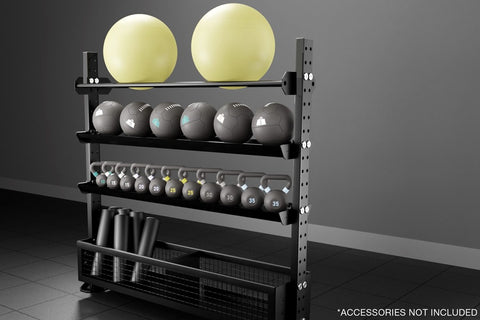 Black metal storage rack with five shelves holding two yellow exercise balls, six gray medicine balls, numbered dumbbells, an
