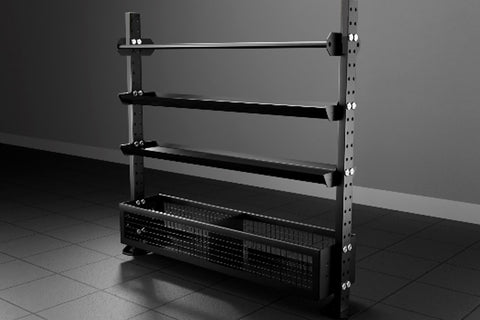 Black metal storage rack with five shelves holding two yellow exercise balls, six gray medicine balls, numbered dumbbells, an