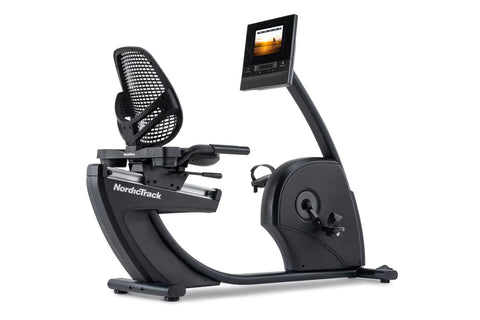 NordicTrack recumbent exercise bike with black mesh seat, curved footrest, dual handlebars, and digital display monitor mount