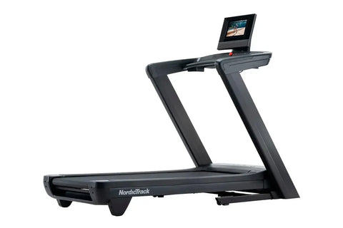NordicTrack Commercial 1250 black treadmill with touchscreen display showing workout video, on white background