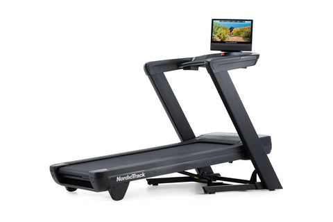 NordicTrack Commercial 1750 black treadmill with attached display screen showing outdoor workout video on white background