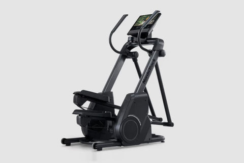 Black elliptical machine with digital display console and curved handlebars on white background