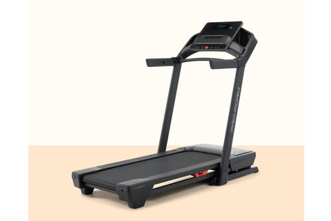 Black ProForm Carbon TLS treadmill with digital console, cushioned running deck, and orange accents on white background