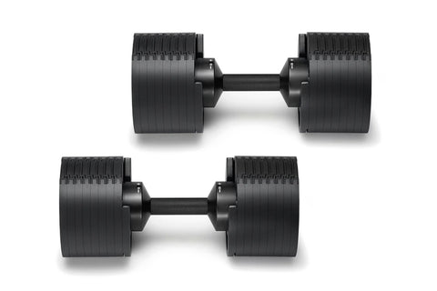 Pair of matte black adjustable dumbbells with ribbed weight plates and black handles on white background