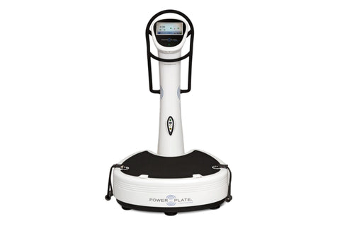 White and black Power Plate vibration plate trainer with digital display screen and handle grips, on white background