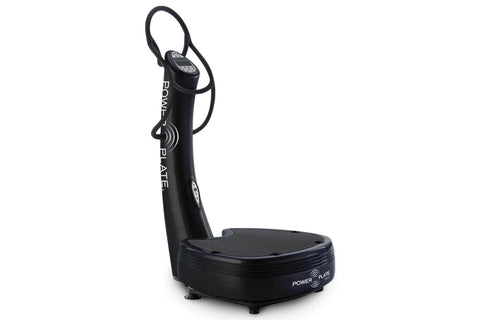Black Power Plate Pro5 vibration fitness machine with digital display, control handles, and wide platform base on white backg