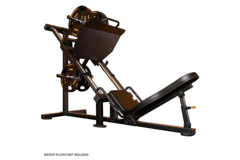 Black and bronze leg press machine with adjustable seat, weight plate pegs, and foot platform on white background