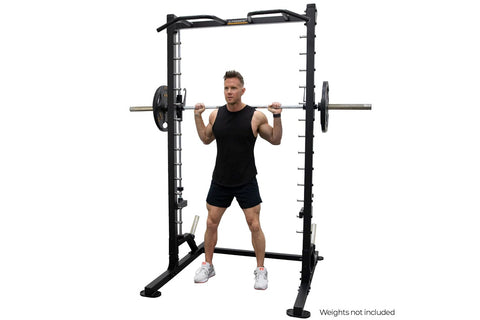 Black and silver smith machine with linear bearing system, weight plate pegs on vertical uprights, and curved safety handles 