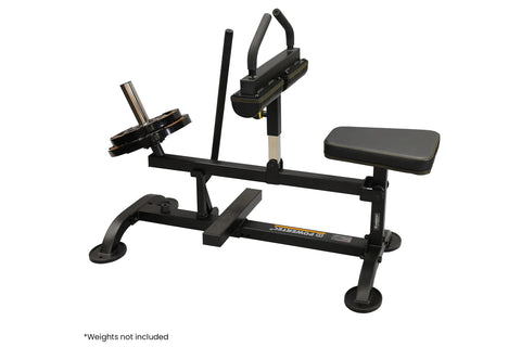 Male model using black seated calf raise machine with weight plate storage, demonstrating exercise form on white background