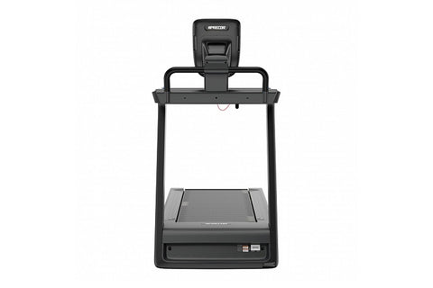 Black motorized treadmill with digital console display, handrails with blue and red handles, and wide running deck on white b