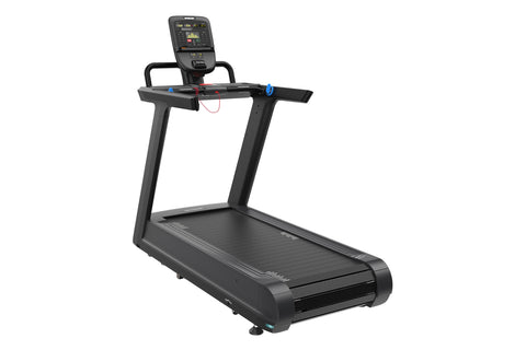 Black motorized treadmill with digital console display, handrails with blue and red handles, and wide running deck on white b