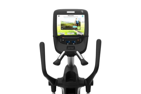 Black elliptical machine with digital console display and fixed handlebars on white background
