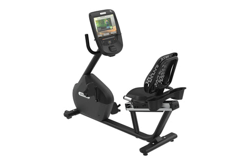 Black recumbent exercise bike with digital console displaying workout metrics, ventilated backrest, and foot pedals on white 