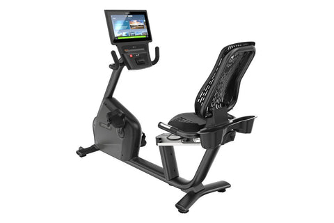 Black recumbent exercise bike with digital console displaying workout interface, featuring padded seat with backrest and foot