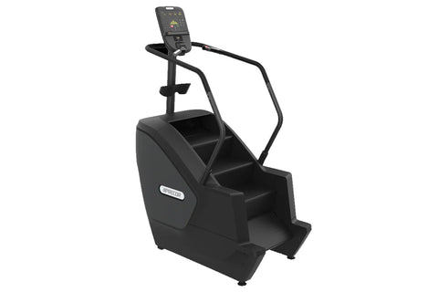 Black Precor stair climber with digital display console, handrails, and wide step platform on white background