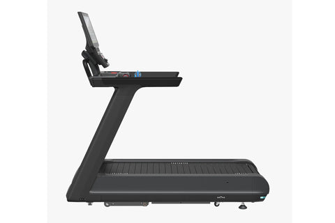 Black commercial treadmill with digital display console, handrails with blue accents, and ribbed running belt on white backgr